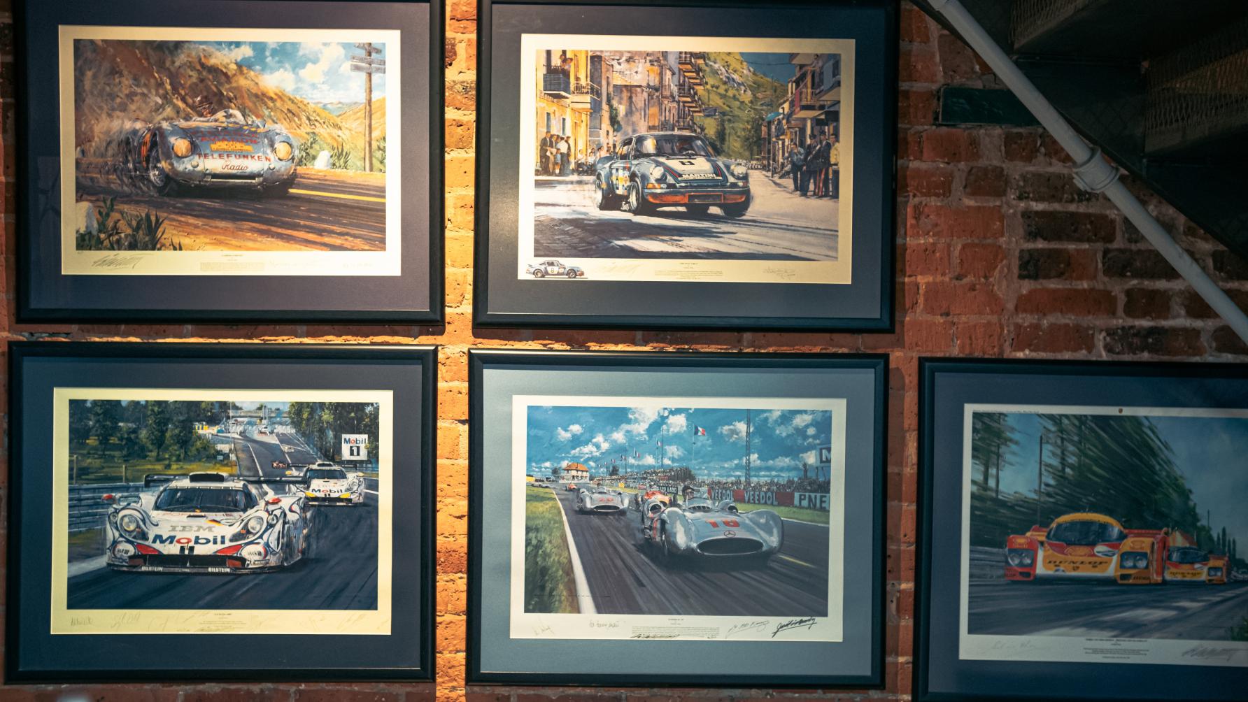 Framed photos of Porsche cars