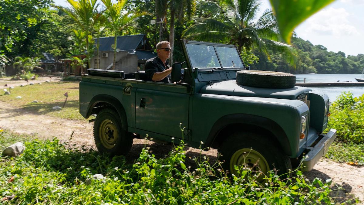 James Bond riding a Jeep