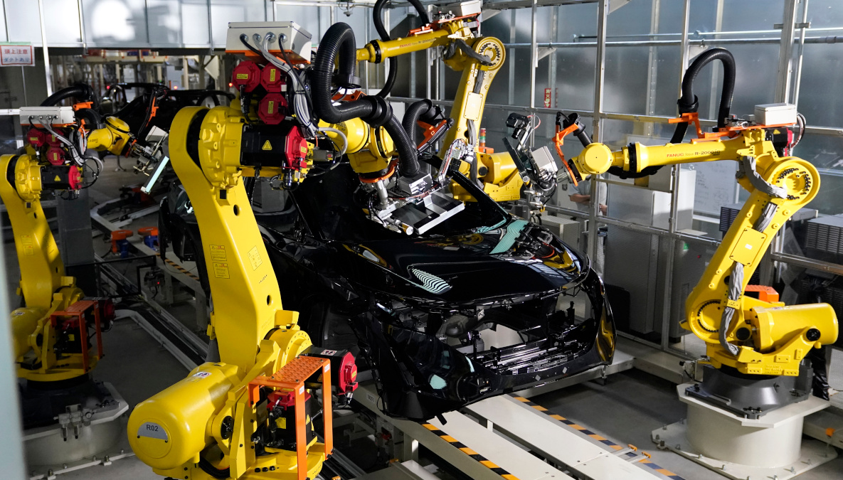 Nissan's new manufacturing robots  assembling a sedan