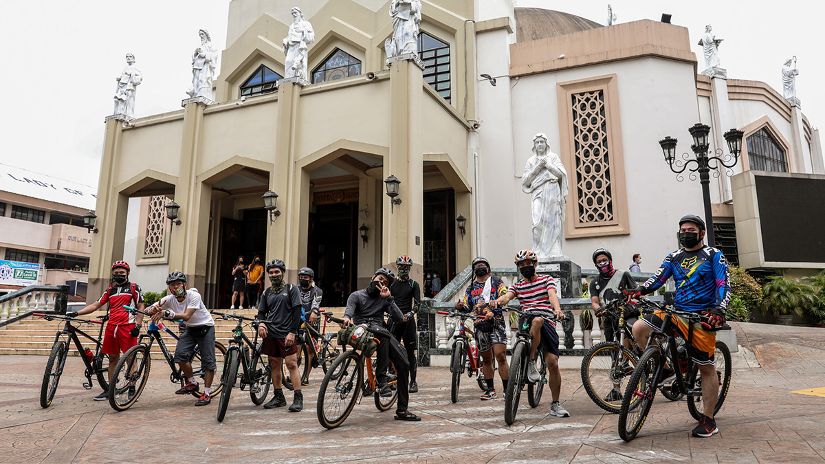 Cyclysts infront of a church