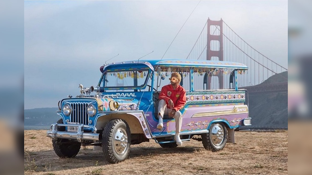 Musician Toro y Moi poses with a Philippine jeepney at the Golden Gate Bridge in San Francisco, California, for the cover of his album ‘Mahal’