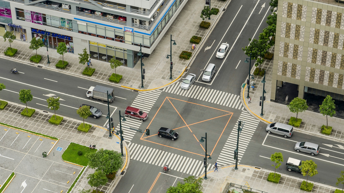 Cars passing through an intersection
