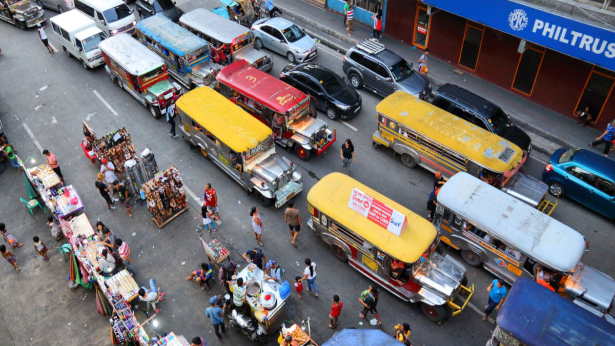 Jeepneys plying a street in Metro Manila