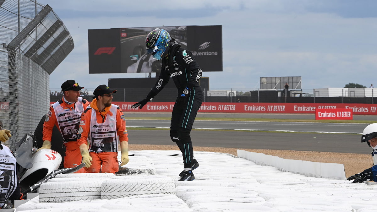 George Russell rushes to check on Zhou Guanyu after Guanyu’s crash at the 2022 British Grand Prix