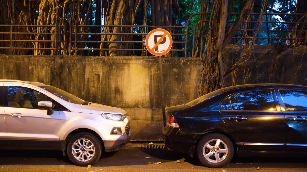 Vehicles parked where there is a no parking sign