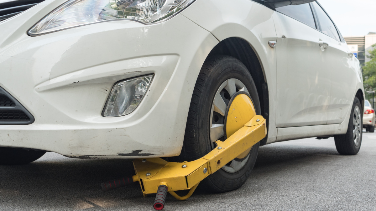 a wheel clamp on an illegally parked vehicle