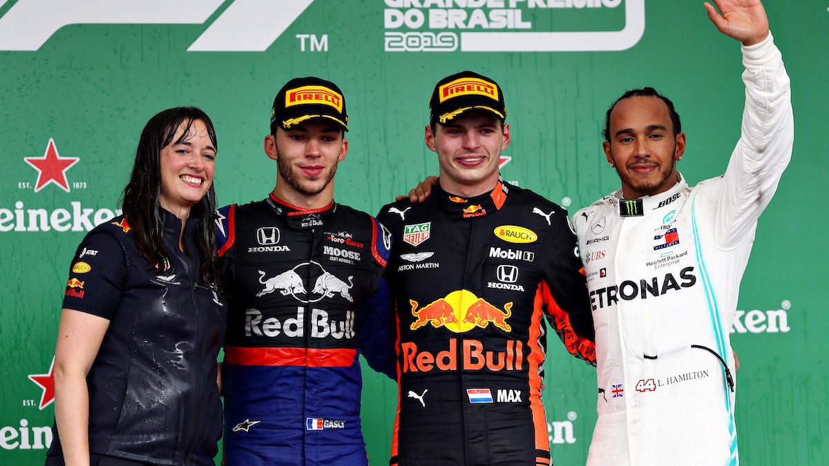 Red Bull Racing driver Max Verstappen and principal strategy engineer Hannah Schmitz celebrate victory at the 2019 Brazilian Grand Prix
