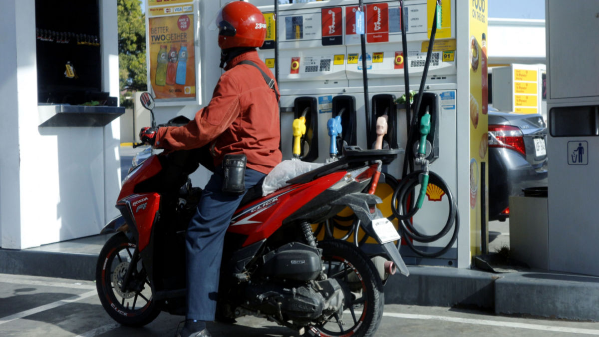 A motorcycle at a fuel station in the Philippines