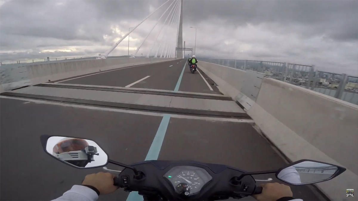 riding through CCLEX or the Cebu-Cordova Link Expressway on a small scooter