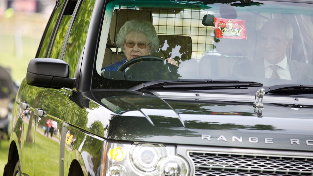Queen Elizabeth II behind the wheel of a Range Rover