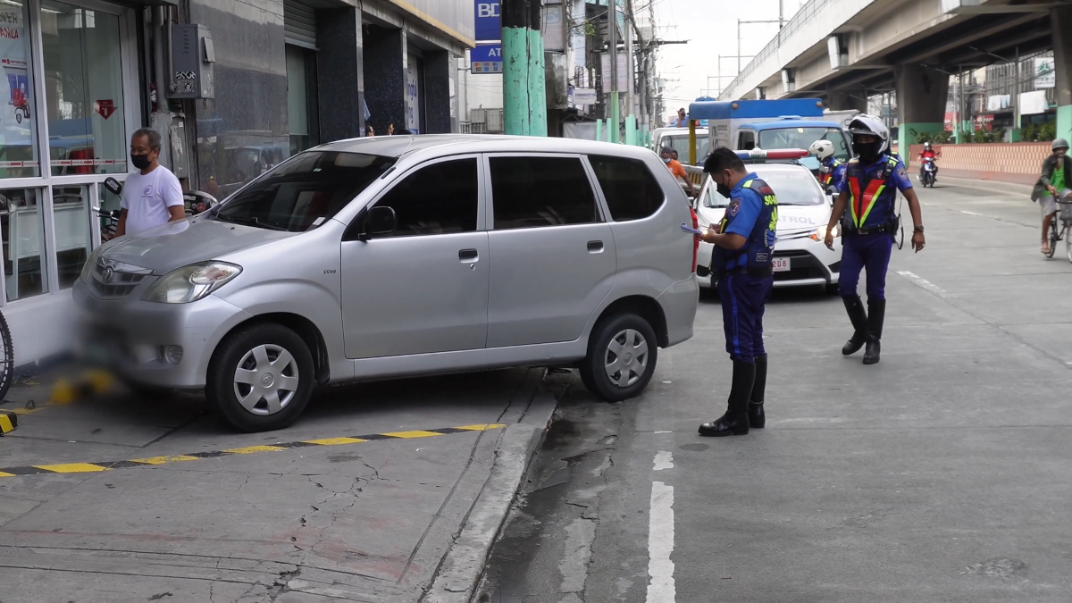 vehicles caught for illegal parking in makeshift parking slots on the sidewalk