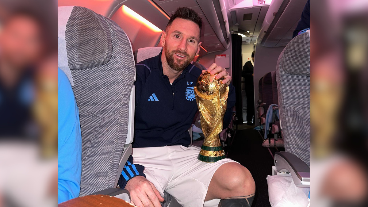 Lionel Messi holding the World Cup trophy