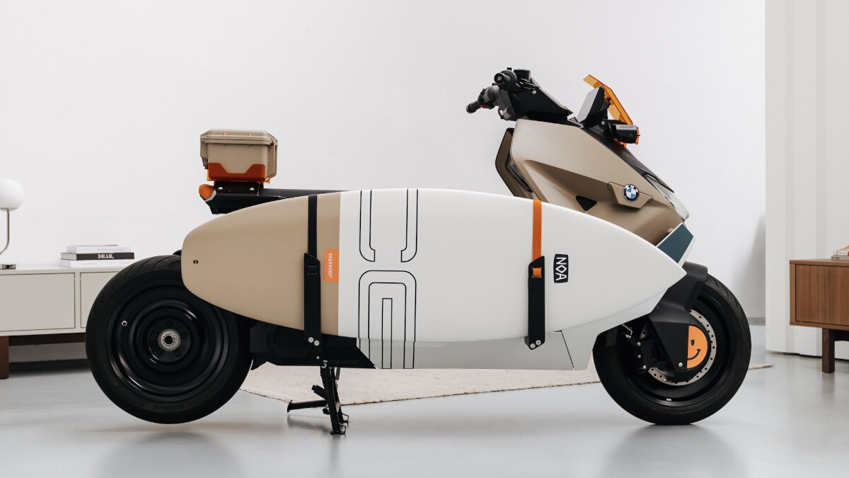 Side view of custom BMW CE 04 by Vagabund Moto with surfboard attached