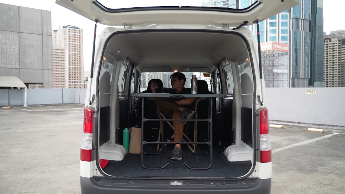 Makeshift mobile office in the cargo area of the Toyota Lite Ace Panel Van