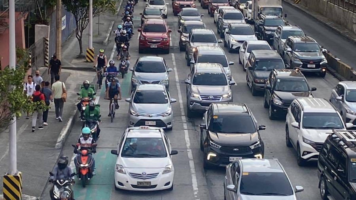 Images of motorcyclists riding inside the bike lane on EDSA