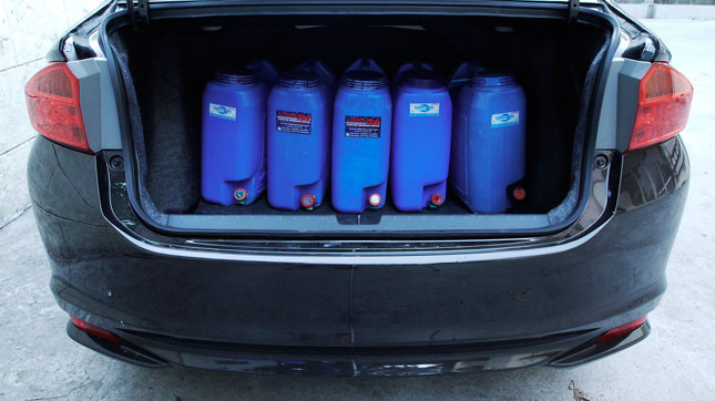 Hauling water in the trunk of the Honda City