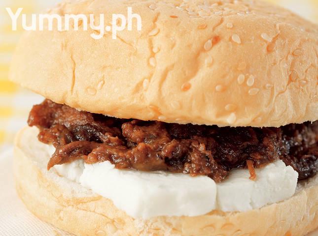 Sandwich with adobo flakes and kesong puti as filling
