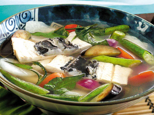 bangus belly sinigang with tomatoes, okra, and radish in a bowl