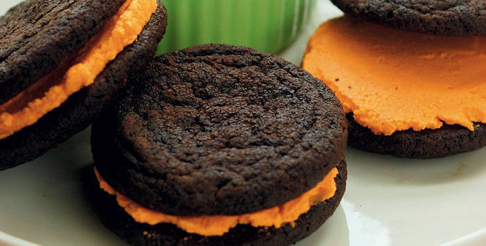 chocolate cookies made with cocoa powder with orange vanilla filling 