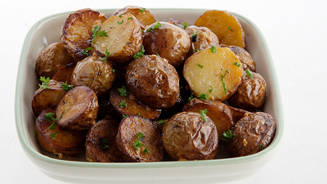 algamja-jorim or soy braised baby potatoes in a condiment dish