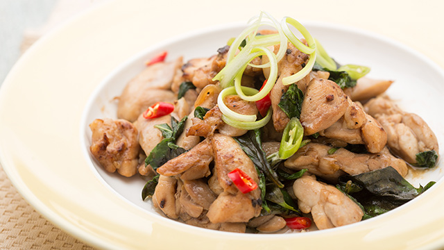pad kra pao or thai basil chicken in a shallow bowl