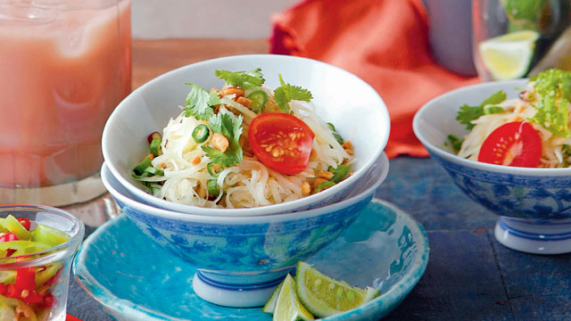 som tam or green papaya salad in a chinese style bowl