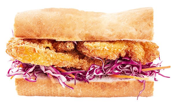 side view of a sub sandwich filled with crunchy cornmeal fish, red cabbage and carrot slices