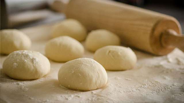 dough balls arranged in pan