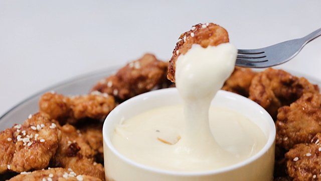 boneless fried chicken pieces and gooey cheese dip
