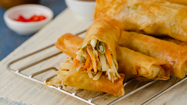 lumpiang togue is filled with bean sprouts, green beans, carrots, and other veggies