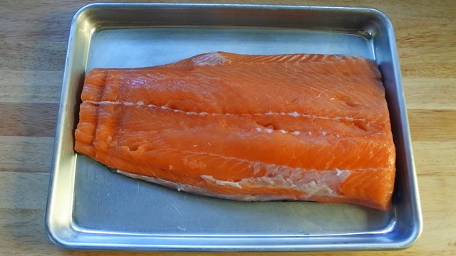 salmon fillet in baking pan