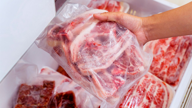 frozen meat from the freezer in plastic packs