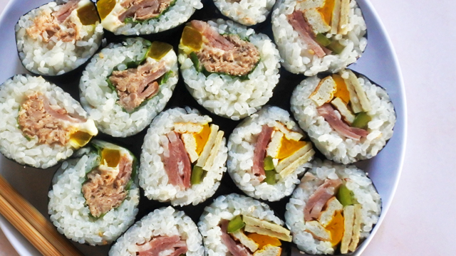tuna kimbap and ham kimbap on a plate