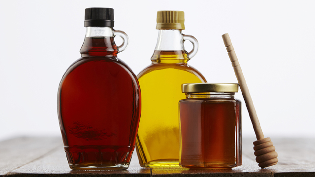 three different syrups in different containers