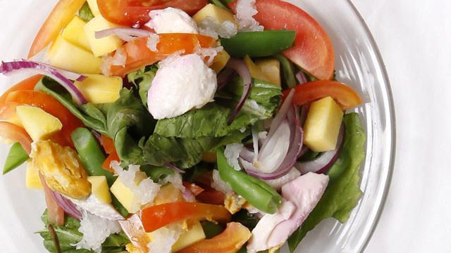 ensalada or salad with salted egg, sitaw, tomatoes, green mangoes, red onions
