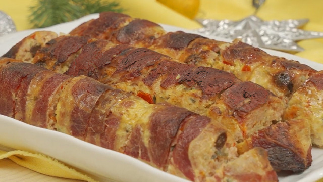 bacon wrapped embutido recipe sliced on a platter ready to serve