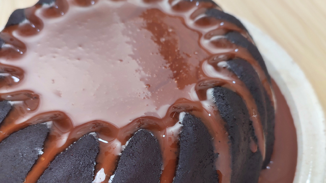 giant chocolate lava cake with chocolate ganache puddle 