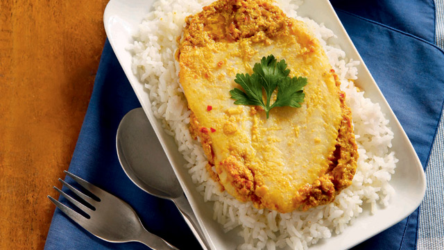 whole fillet cut of cream dory in an omelet, served on top of rice